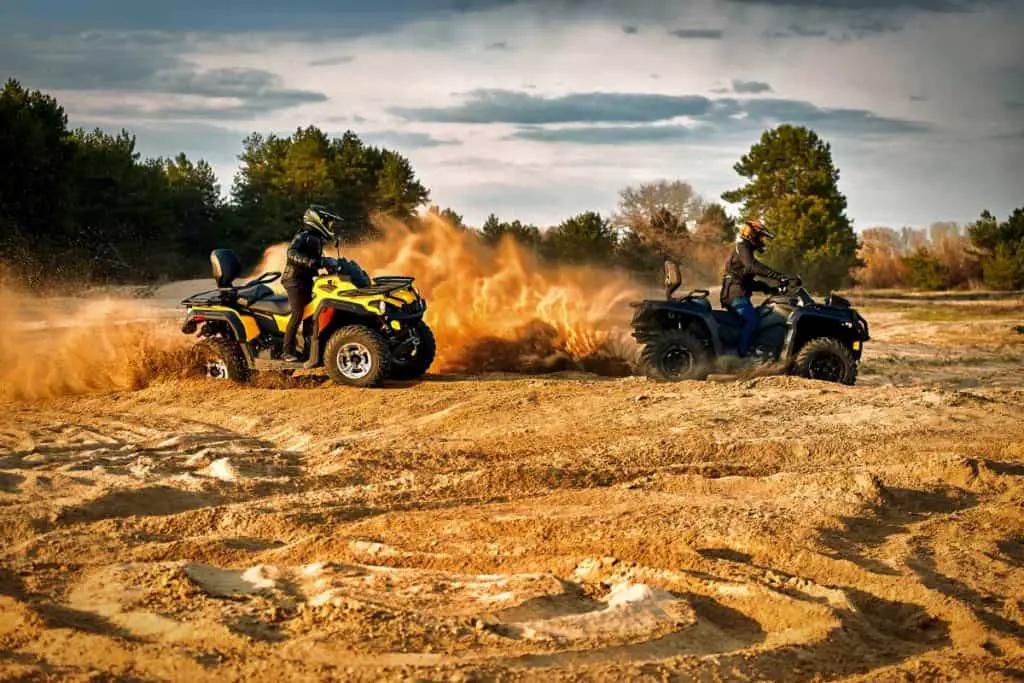 Racing in the sand on a four-wheel drive quad