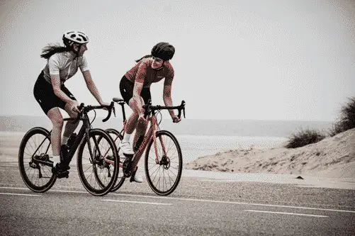 2 people on a bike