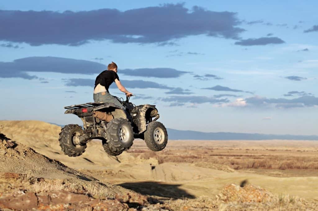 Teen on quad - four wheeler