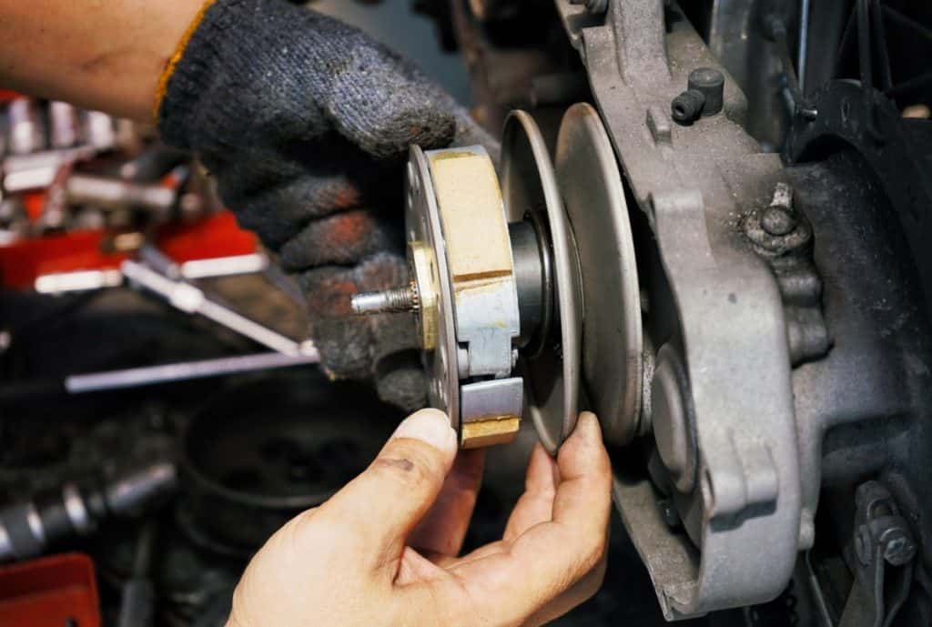 Mechanic working installing Clutch system